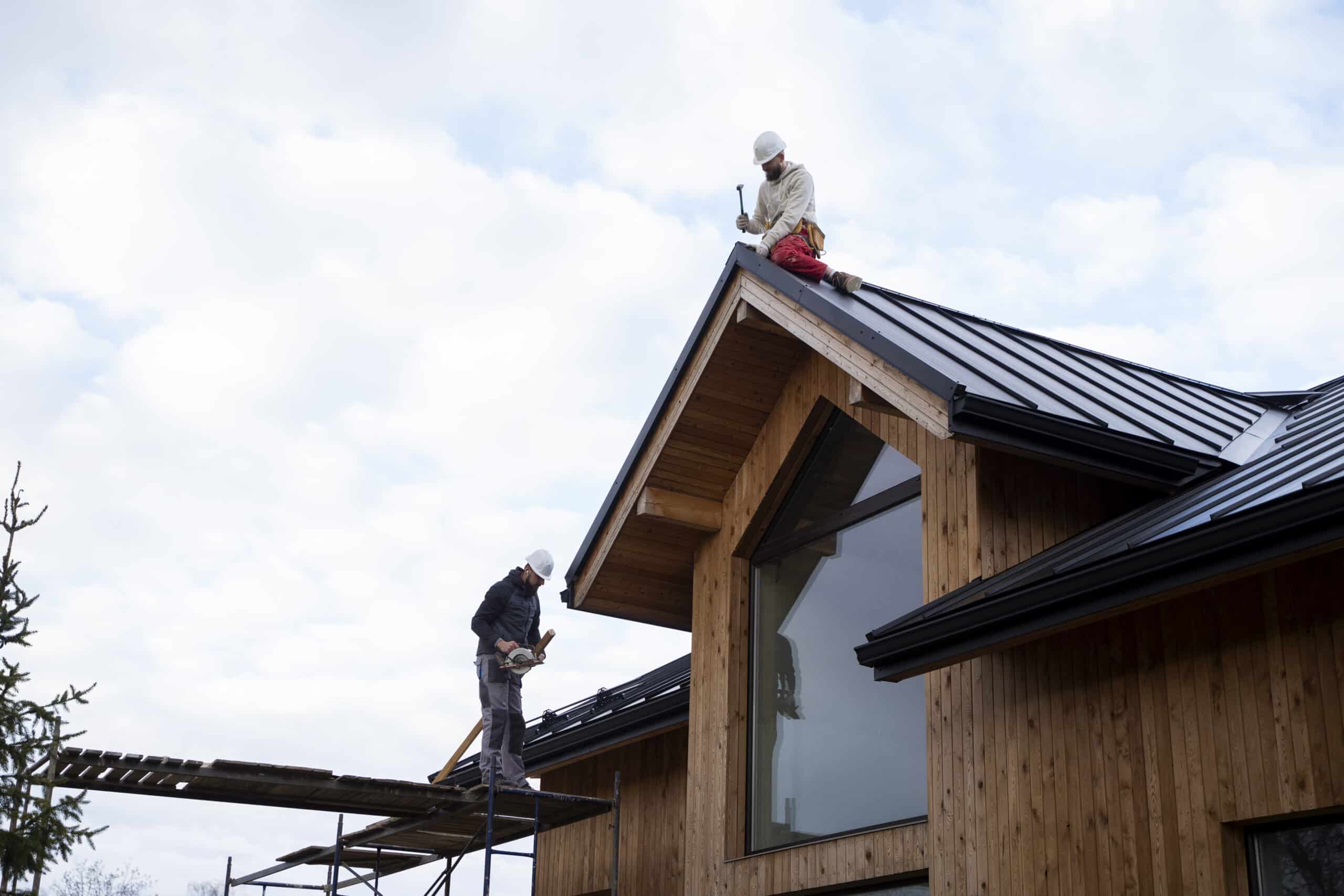 long shot men working roof scaled